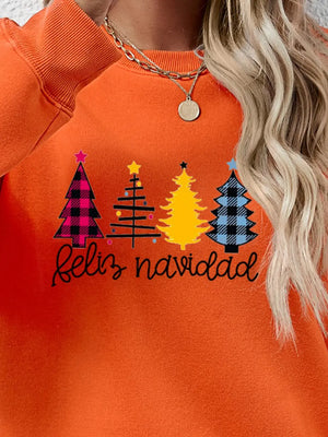 Orange crewneck sweatshirt with Feliz Navidad graphic and Christmas trees.