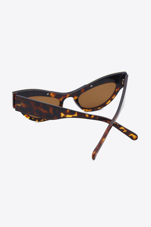 Tortoiseshell cat-eye sunglasses with crystal embellishments and brown lenses.