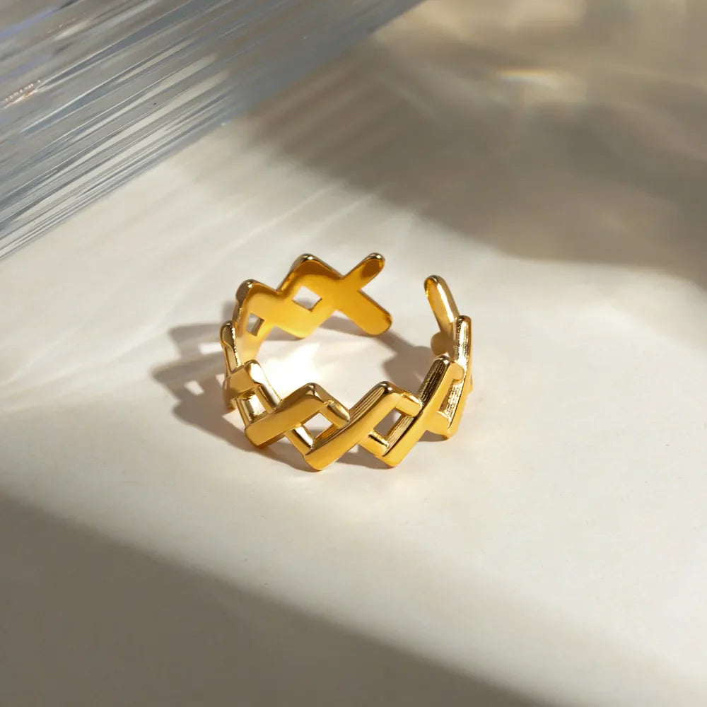 Geometric openwork gold ring with cutout design, 18K gold-plated and adjustable.