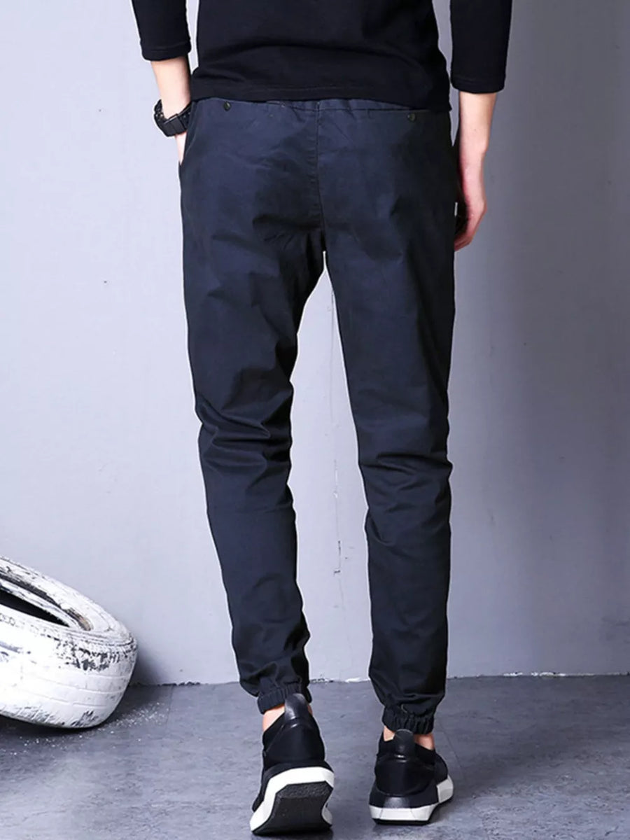 Men's black casual pants with elastic cuffs and drawstring waist