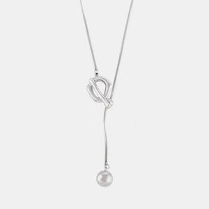 Silver lariat necklace with toggle clasp and dangling ball pendant