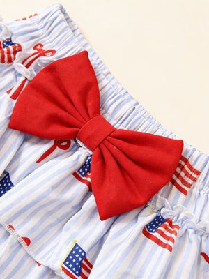 Baby set with blue stripes, American flag print, and red bow detail.