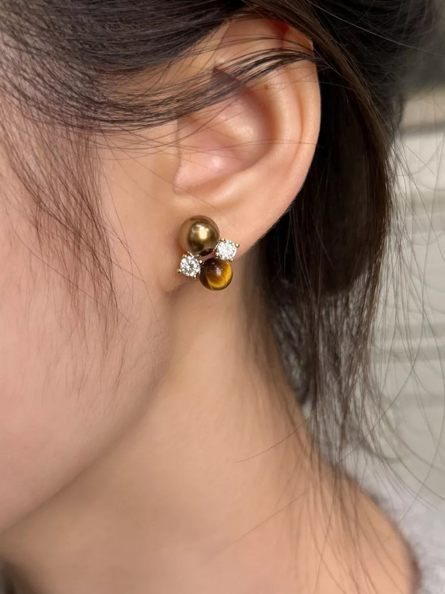 Spherical tiger eye stone stud earrings with clear accents and a cluster design.