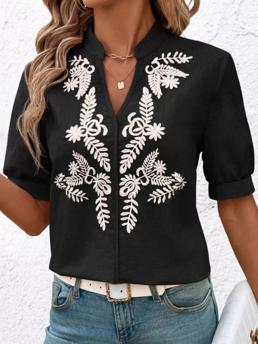 Black embroidered notched blouse with cuffed sleeves and V-neck.