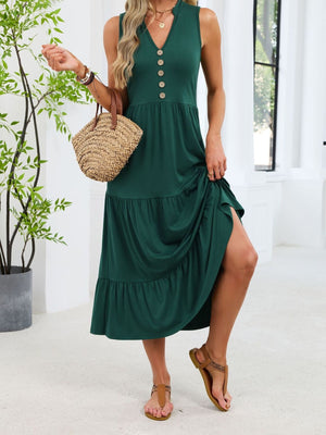 Dark green tiered midi dress with notched V-neck and decorative buttons.
