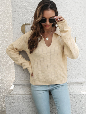 Ivory textured polo neck sweater with a v-neck and long sleeves.