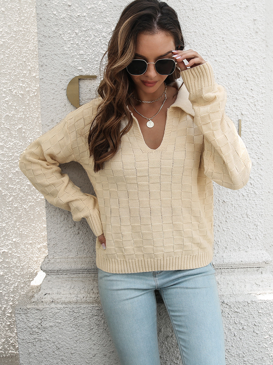 Ivory textured polo neck sweater with a v-neck and long sleeves.