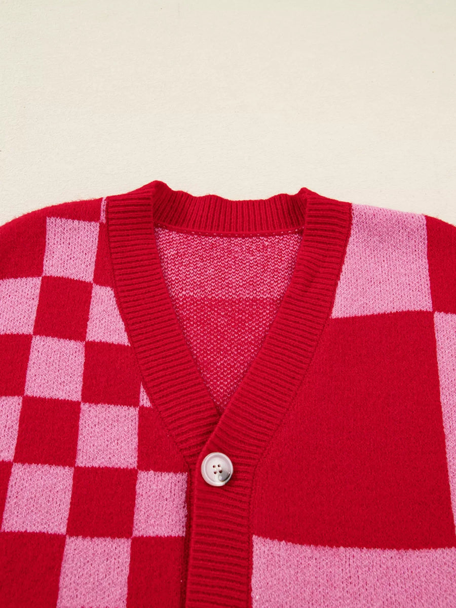 Checkerboard knit cardigan in deep rose with a V-neck and button closure.