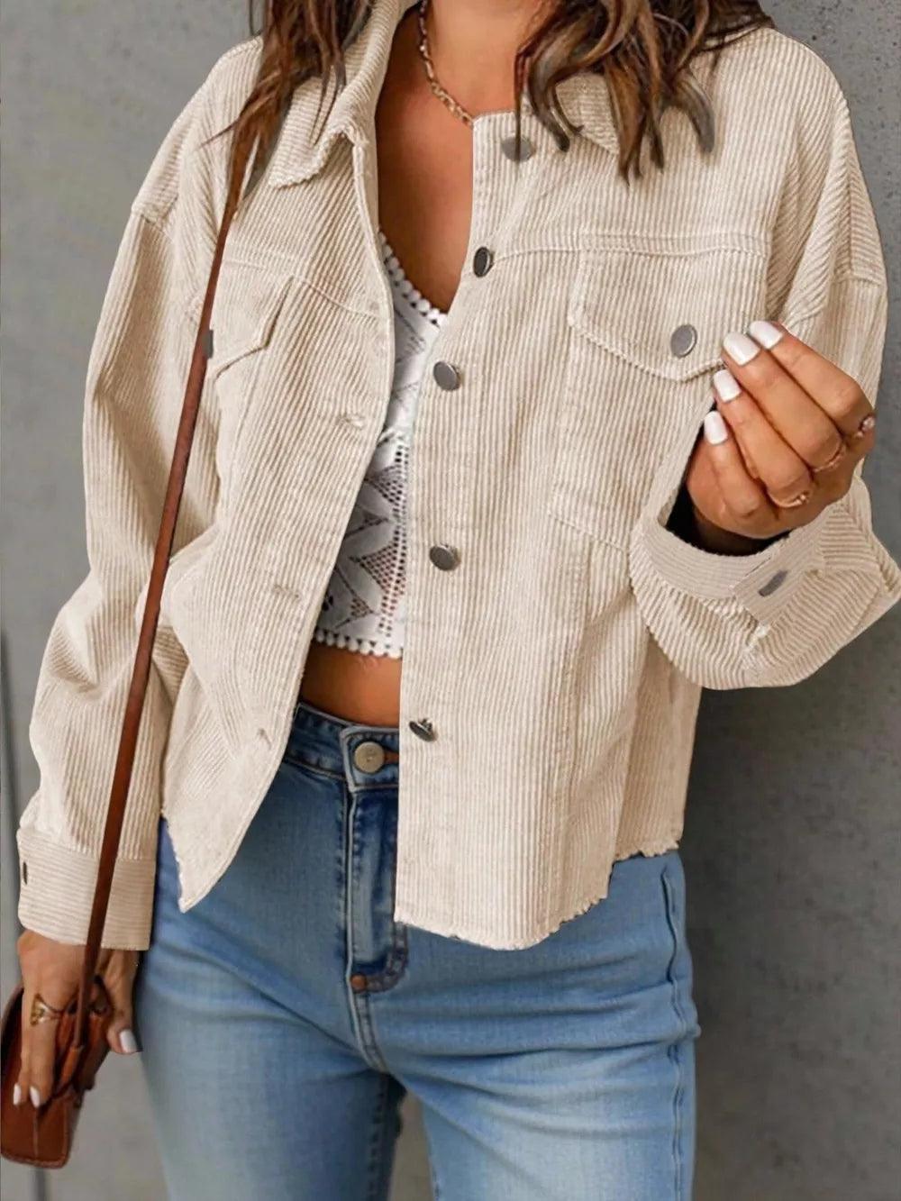 shacket in cream featuring buttoned and relaxed fit