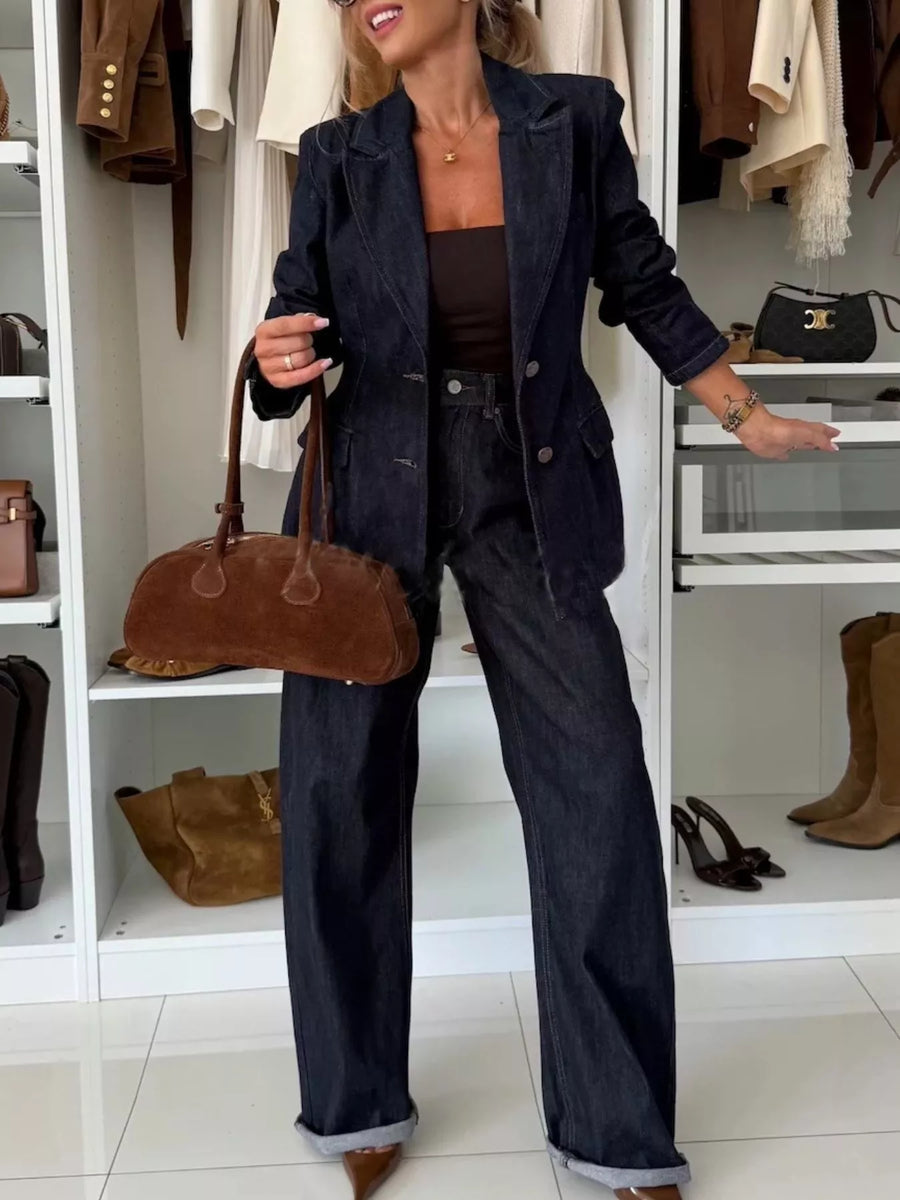 Dark navy high-waisted wide-leg denim jeans with cuffed hems.