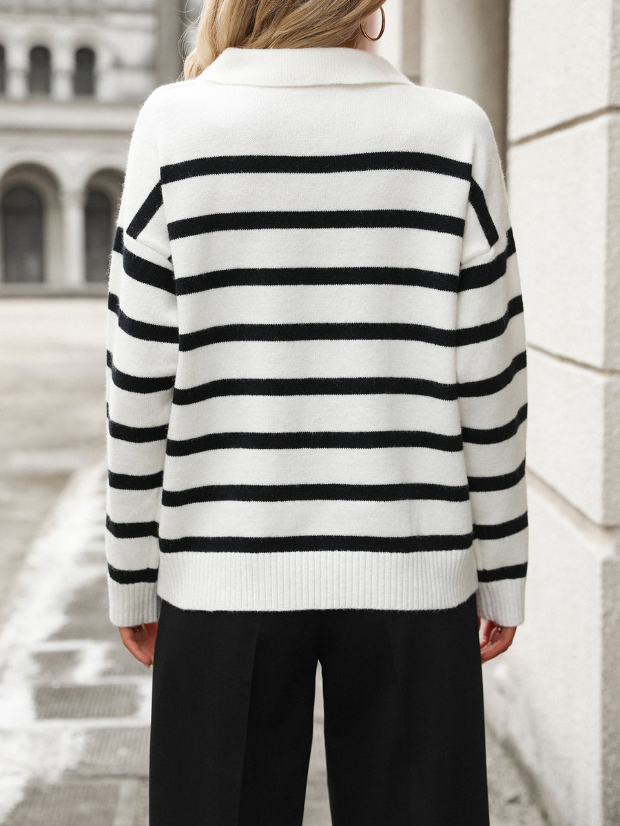 Striped polo-neck knit pullover sweater in white with black horizontal stripes and ribbed cuffs.
