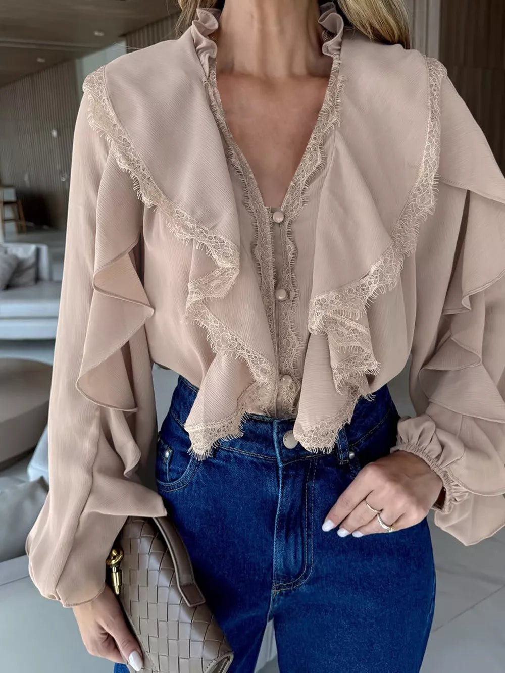 beige blouse with ruffles and long sleeve