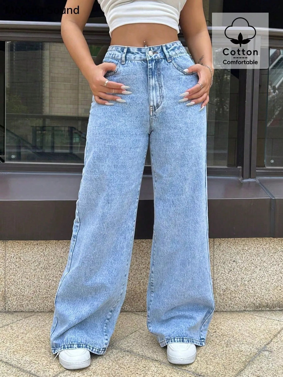 Wide-leg blue denim jeans with pockets and a comfortable cotton blend.