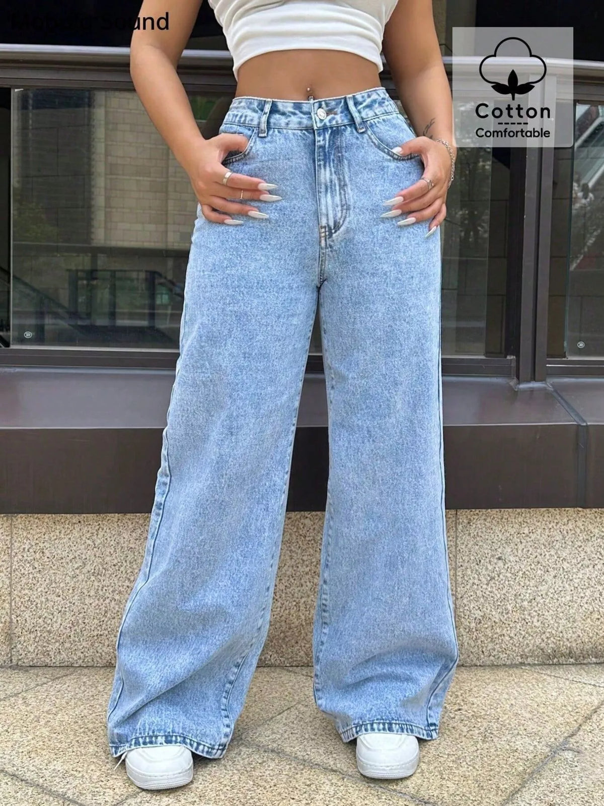 Wide-leg blue denim jeans with pockets and a comfortable cotton blend.