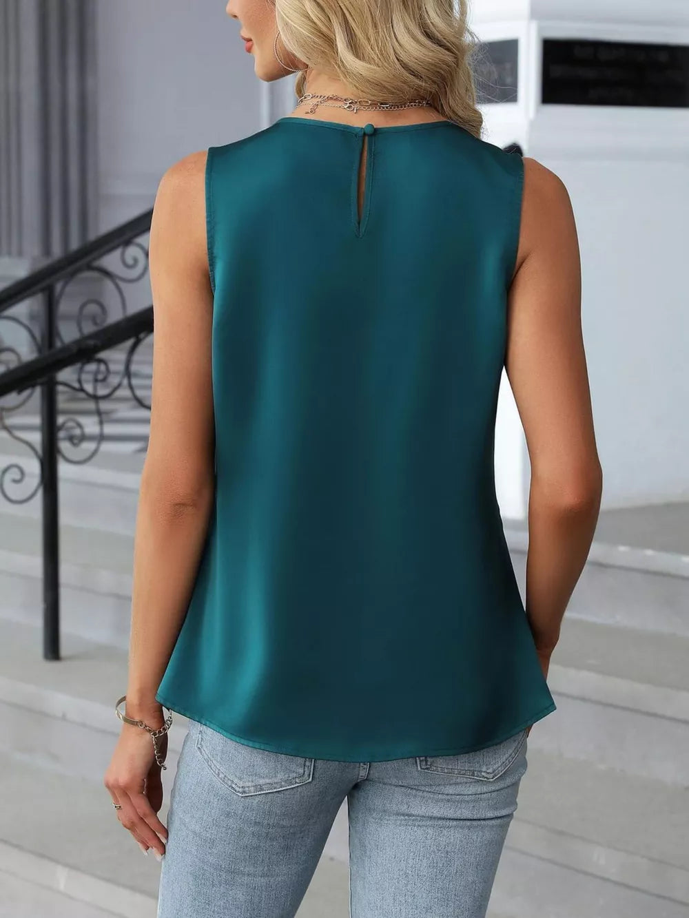 Teal pleated round neck sleeveless tank top with keyhole back detail.