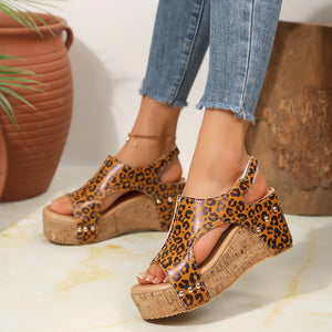 Leopard cutout cork wedge sandals with gold stud details in caramel color.