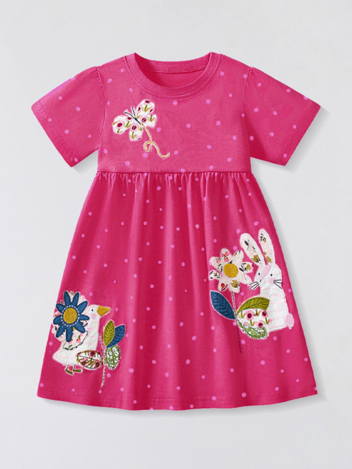 Pink polka dot cotton dress with embroidered animals and flowers, crew neck, short sleeves.