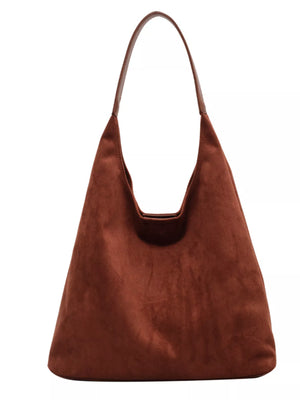 Women's casual suede shoulder bag in rust with a single strap.