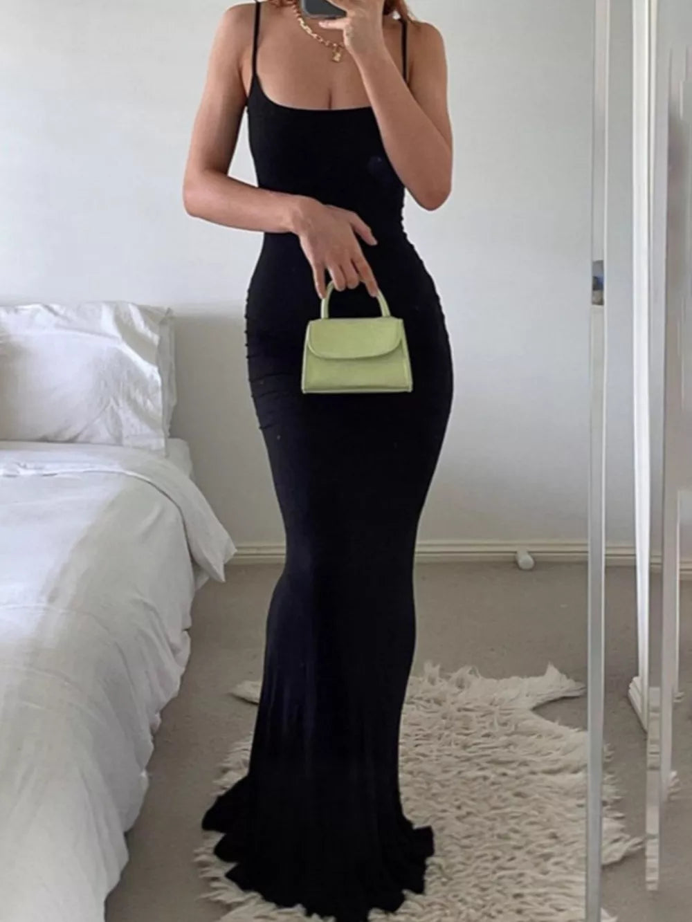 maxi dress in black featuring spaghetti strap and bodycon fit