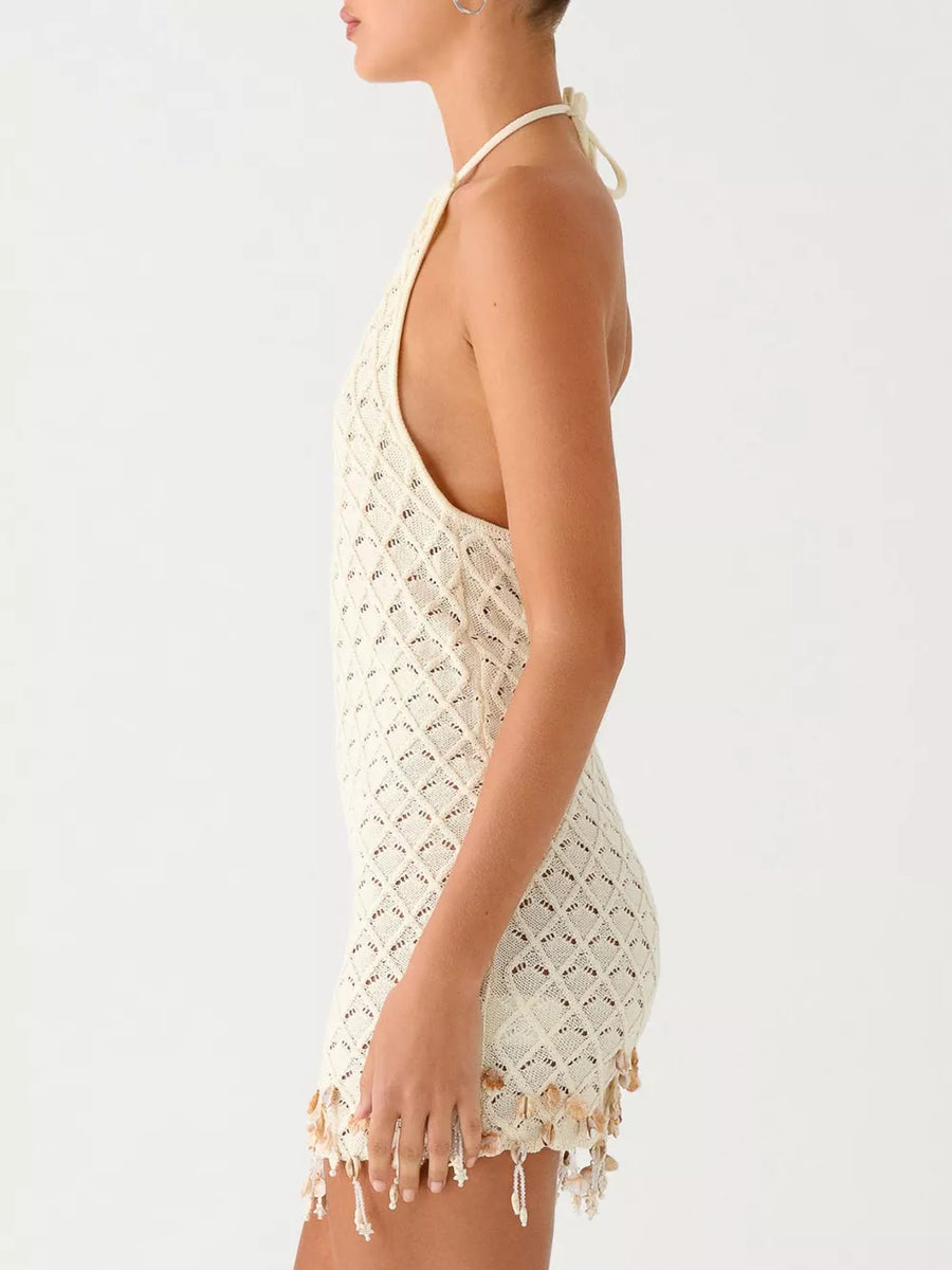 Cream crochet halter mini dress with diamond pattern and shell fringe hem