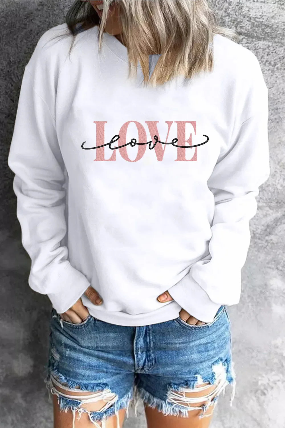 White crewneck sweatshirt with pink and black LOVE graphic print