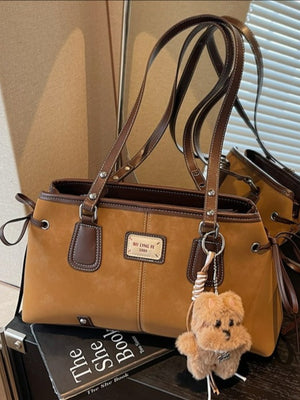 Side Tie Shoulder Bag in dark brown with side ties