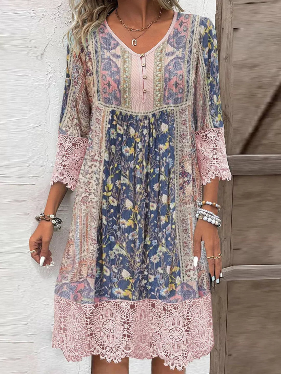 Pink floral lace trim V-neck dress with bohemian patchwork print and 3/4 sleeves.