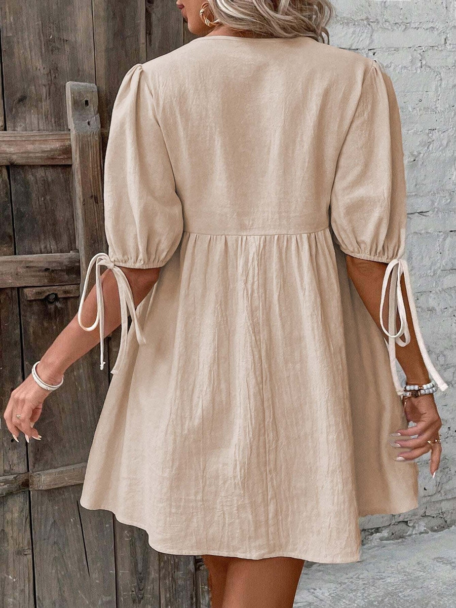 Beige tie front puff sleeve mini dress with adjustable tie cuffs