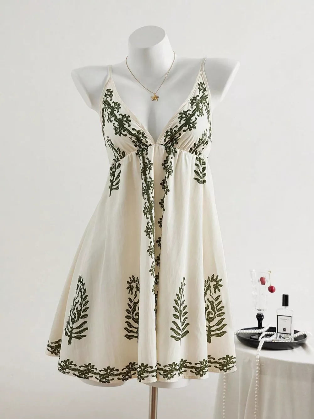 ivory mini dress with botanical-print and v-neck