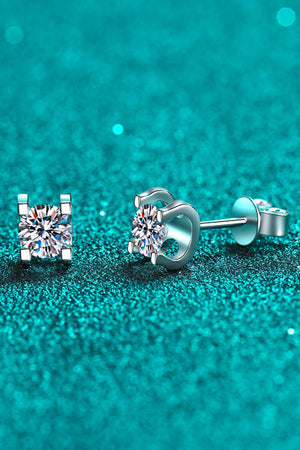 Silver moissanite stud earrings with sculpted settings.