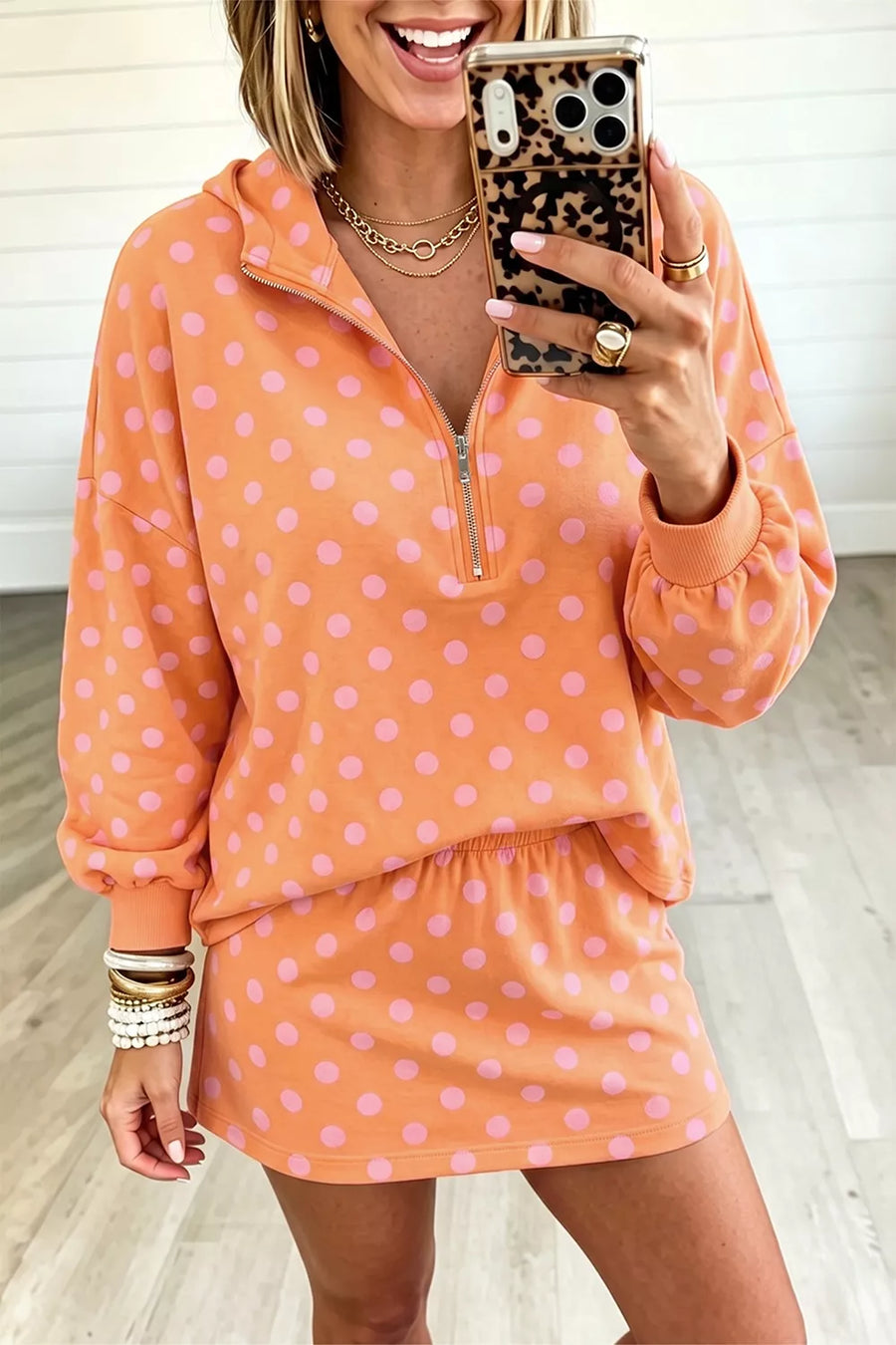 light pink two-piece set featuring zipper and polka dot