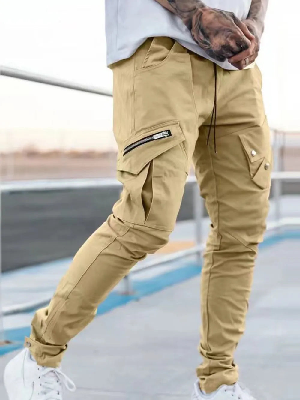 Tan cargo pants with zip pocket detail and slim fit