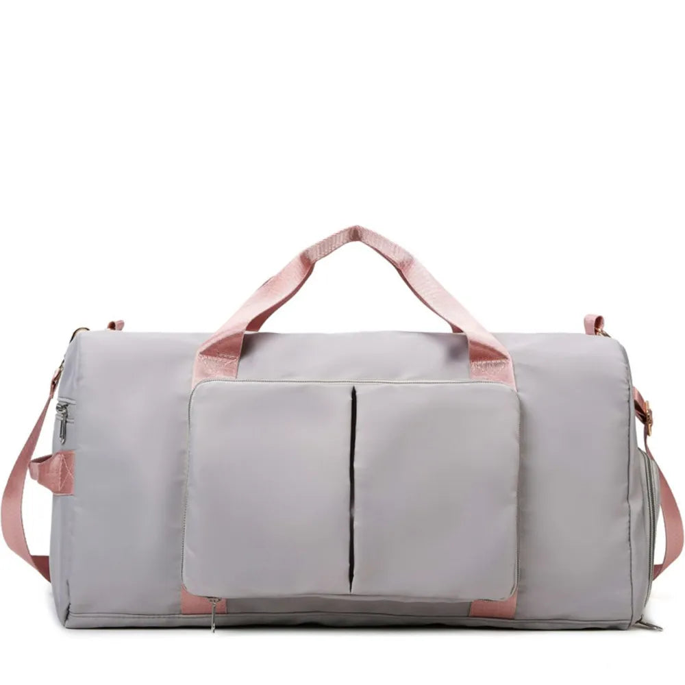 Light Gray duffel bag with pink trim and straps, featuring a front pocket with two vertical zip compartments.
