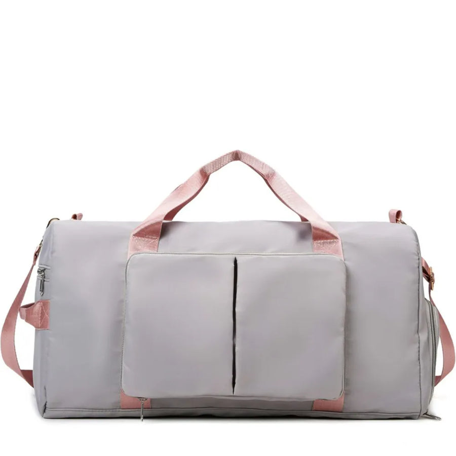 Light Gray duffel bag with pink trim and straps, featuring a front pocket with two vertical zip compartments.