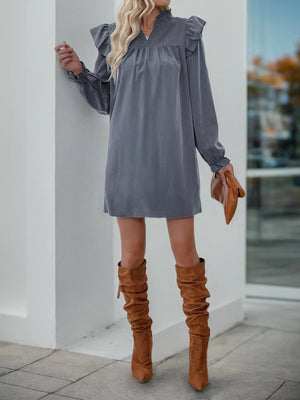 Dark gray ruffled notched sleeve dress with V-neck and cinched cuffs.
