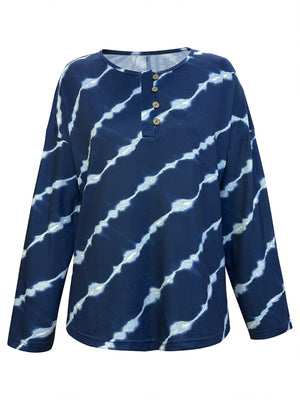 Indigo tie-dye henley top with button placket and long sleeves in peacock blue.