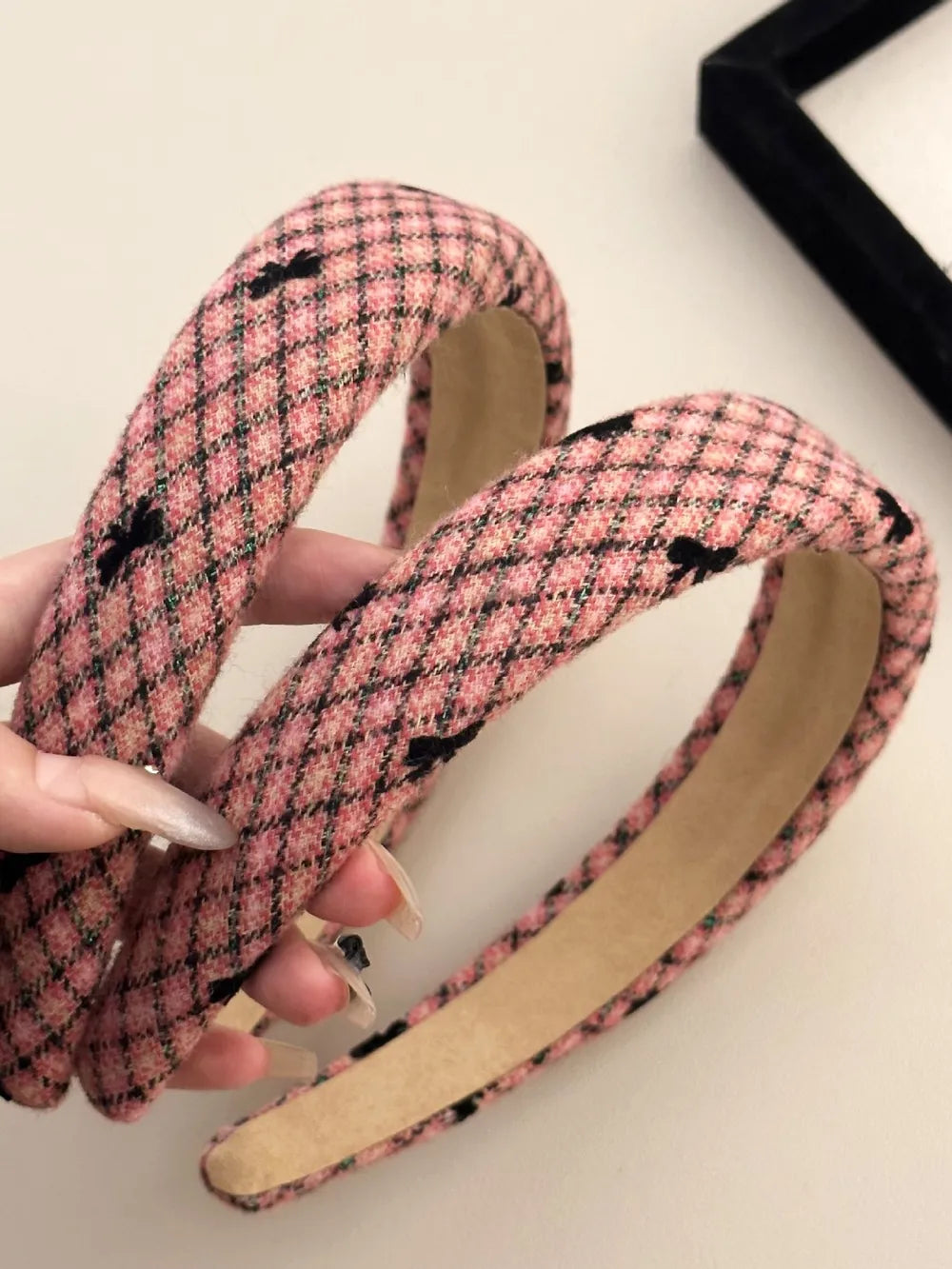 Pink tweed headband with black bow details