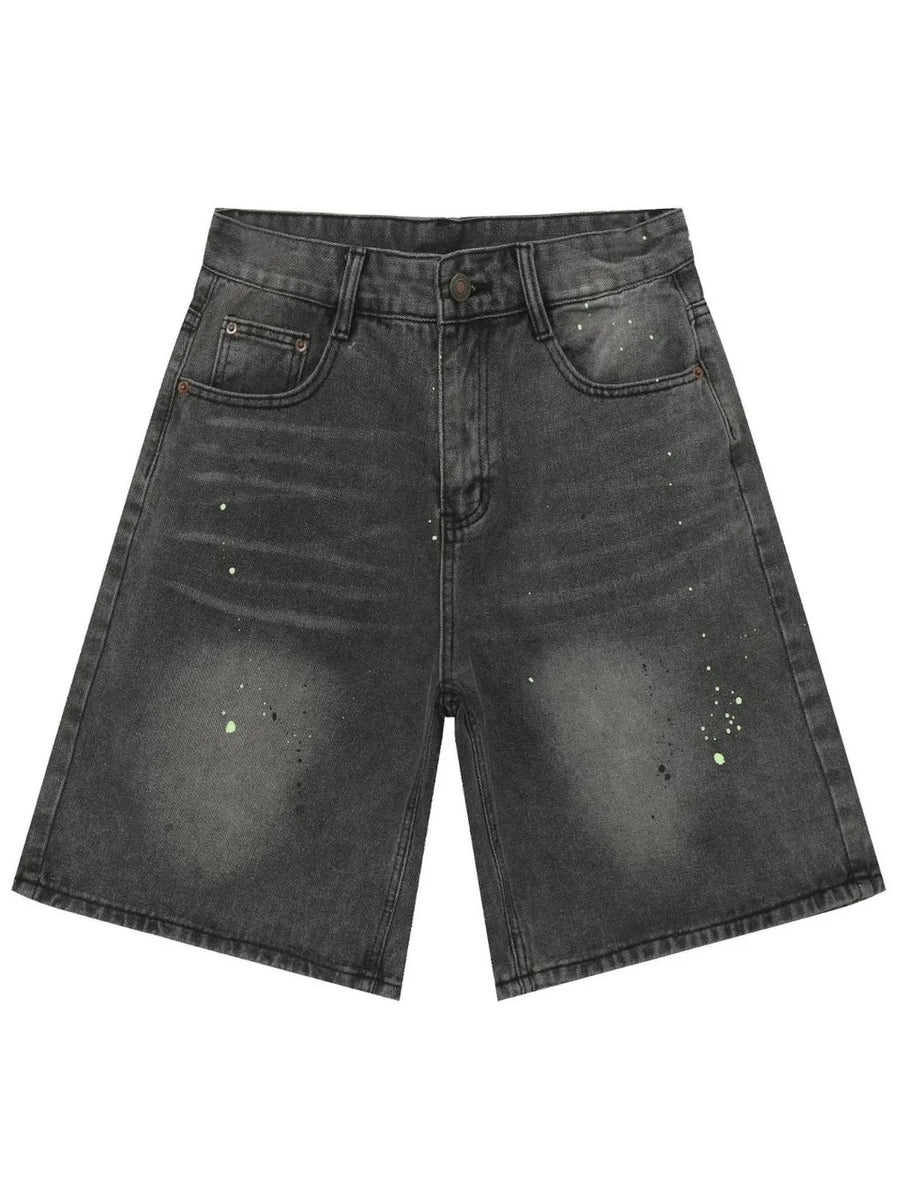 Dark wash denim bermuda shorts with paint splatter detail