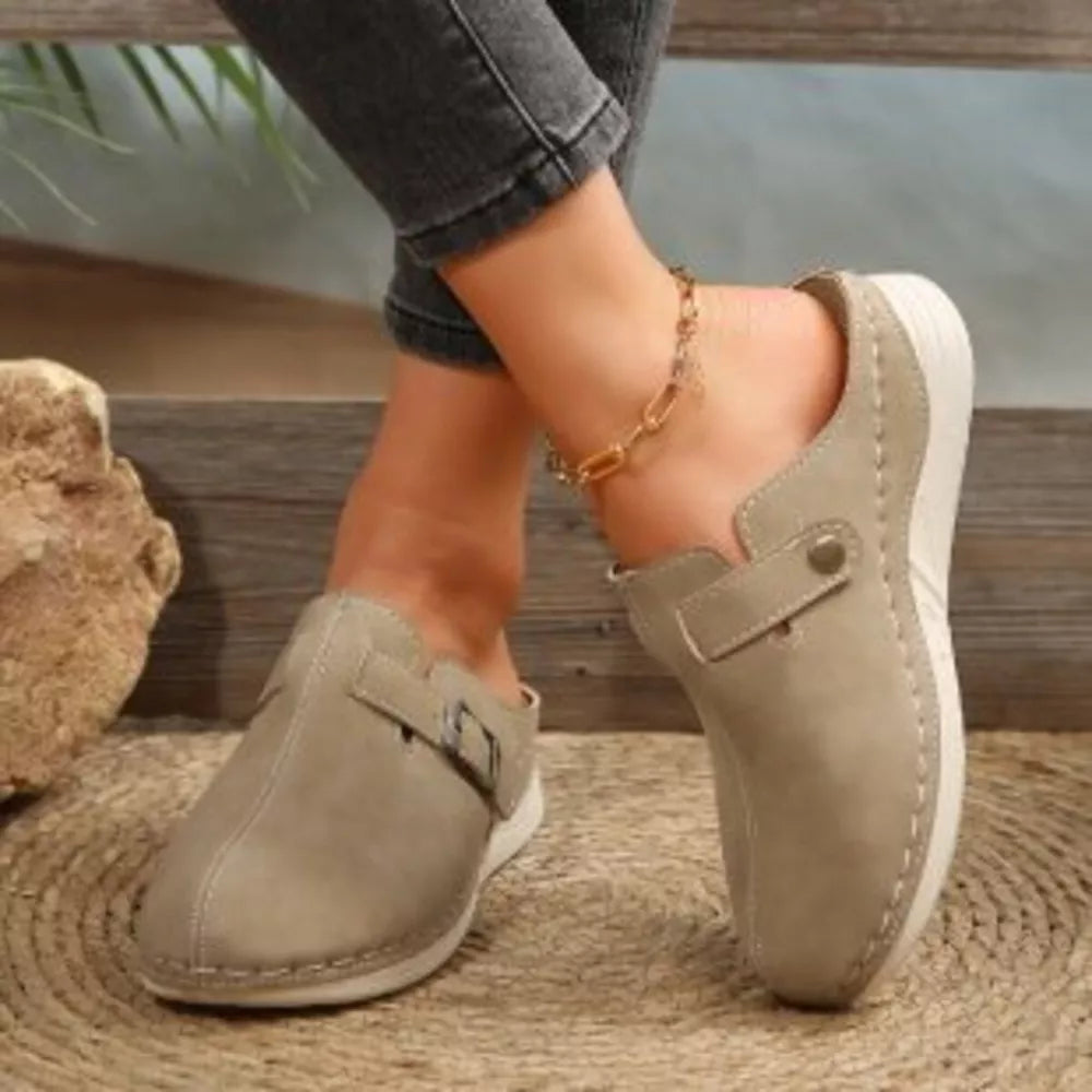 Buckle accent round-toe slip-ons in khaki with contrast stitching and a comfortable casual style.