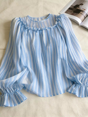 light blue blouse with striped and round neck