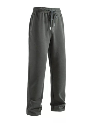 Men's dark gray drawstring loose fit sweatpants with side pockets.