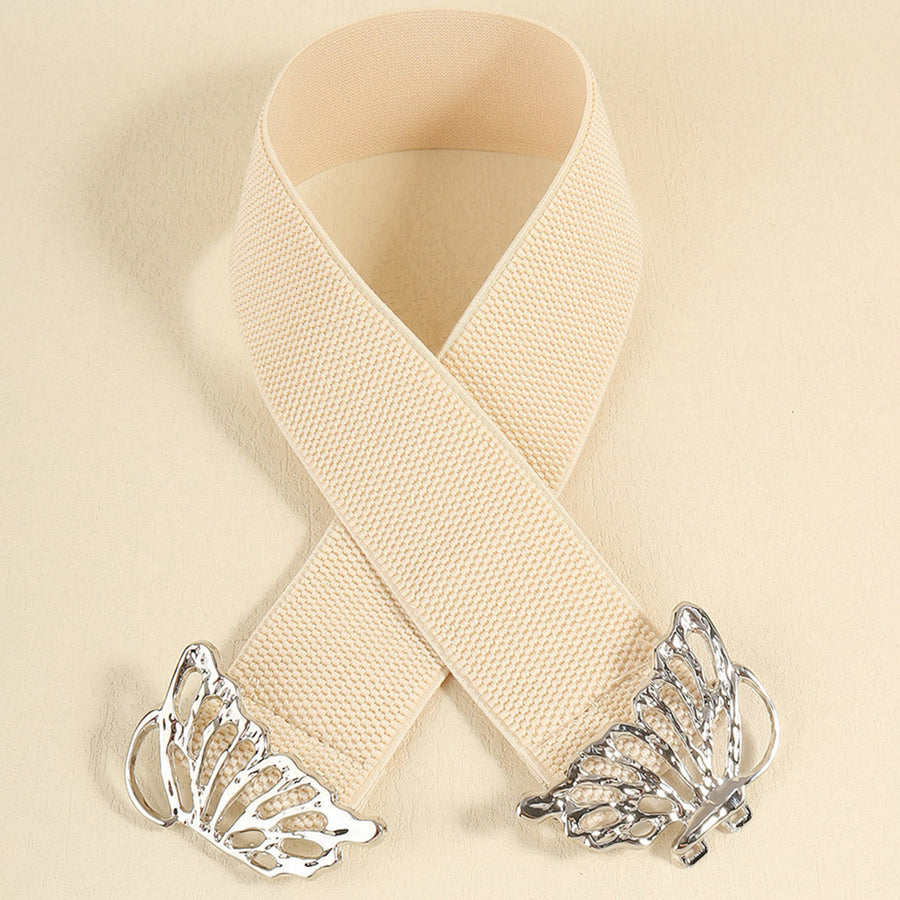 Elastic waist belt in light yellow with silver butterfly buckle detail