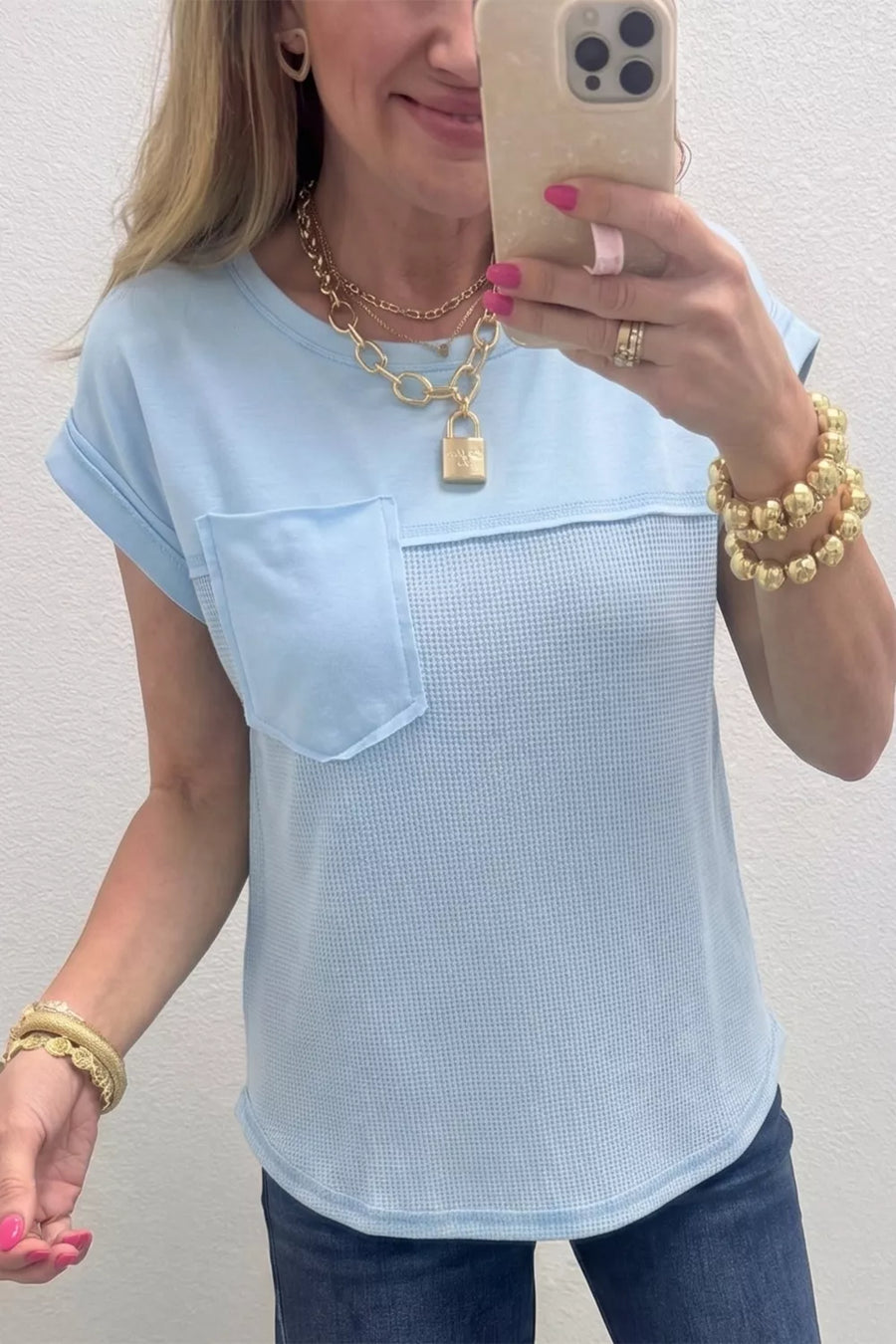 Light blue waffle knit t-shirt with a chest pocket and curved hem