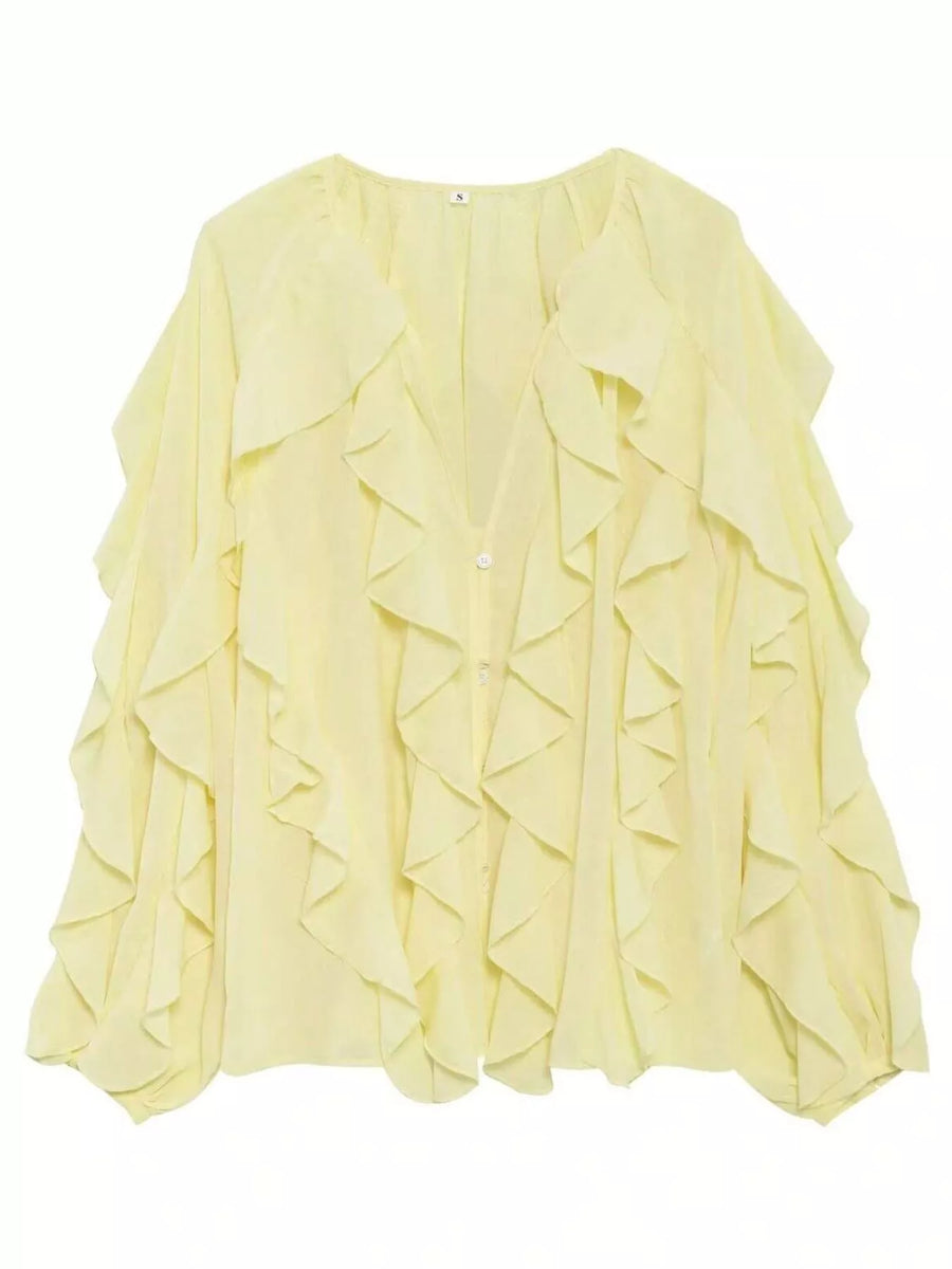 Yellow sheer long-sleeve blouse with cascading ruffles and a V-neckline.