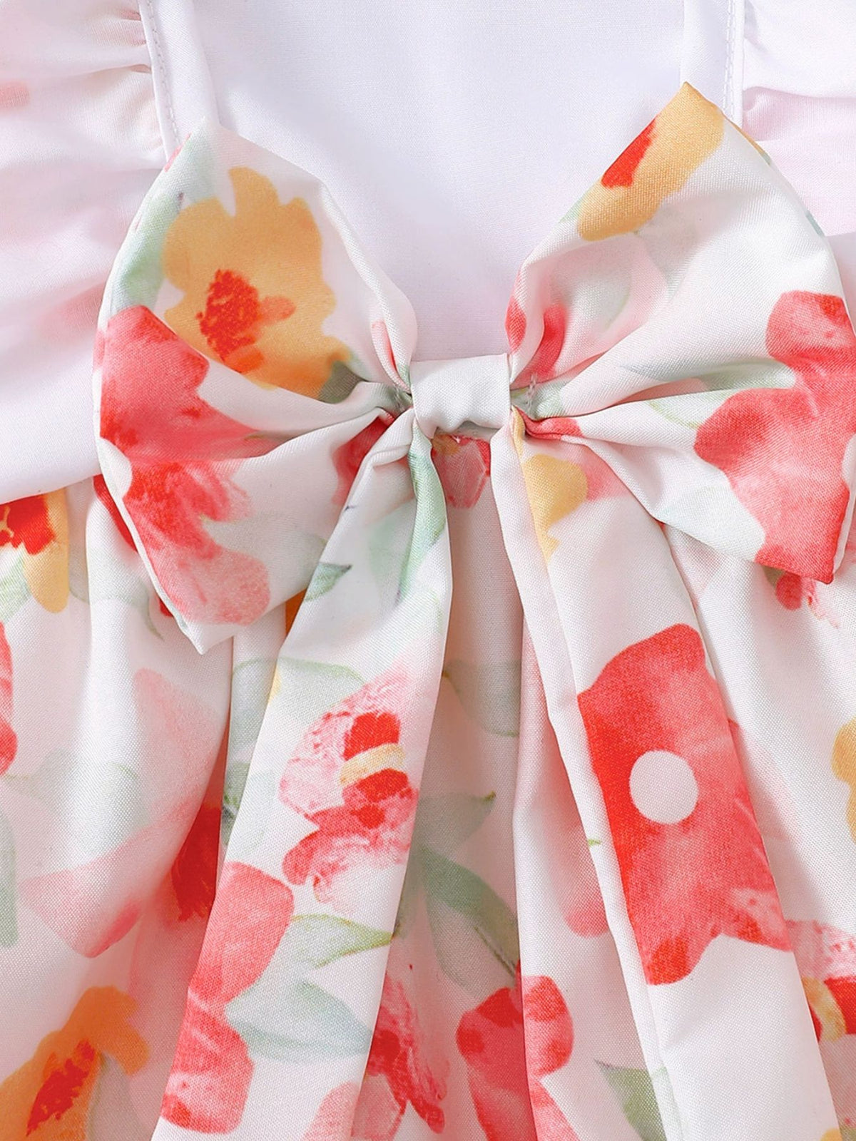 Floral print baby bodysuit with a large bow detail and matching headband.