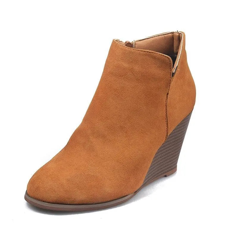 Ochre suede wedge ankle boots with side zipper detail.