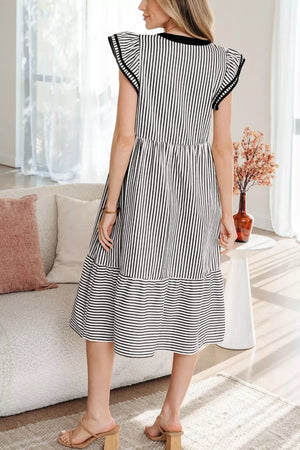 Black and white striped cotton midi dress with tiered skirt and flutter sleeves.