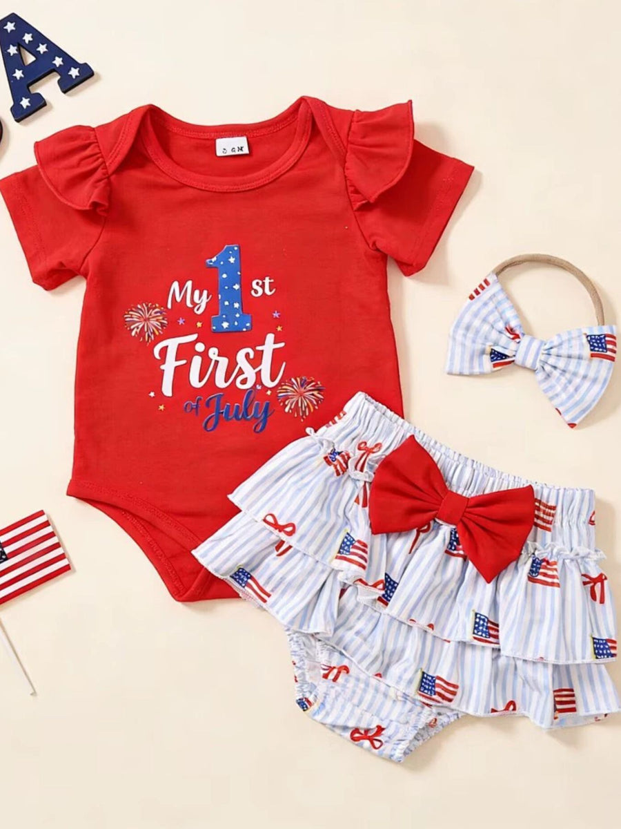 Red patriotic baby bodysuit with ruffled sleeves, striped bloomers with American flag print, and matching headband.
