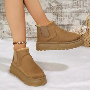Caramel suede round toe platform ankle boots with faux fur lining and elastic gore.
