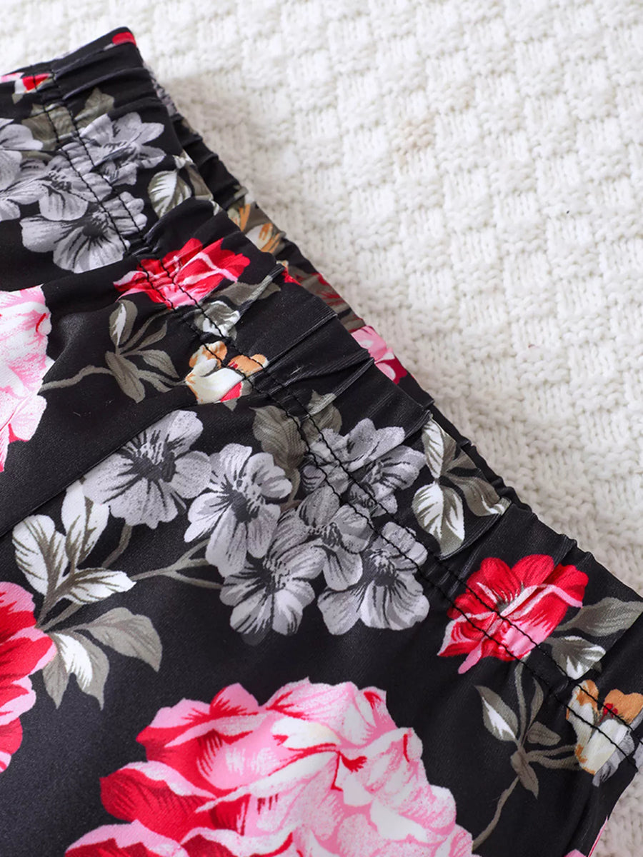 Black floral print flared pants with elastic waistband detail